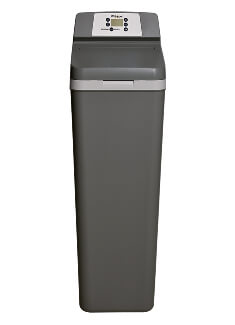 A tall, gray water softener stands upright featuring a control panel indicating functionalities, on a plain white background.